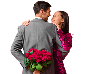 A man welcoming a woman with a bouquet of red roses
