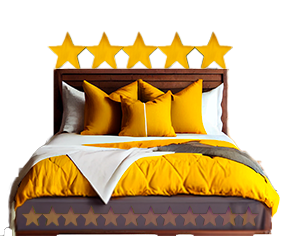 A double bed with golden bedding and five stars above the headboard